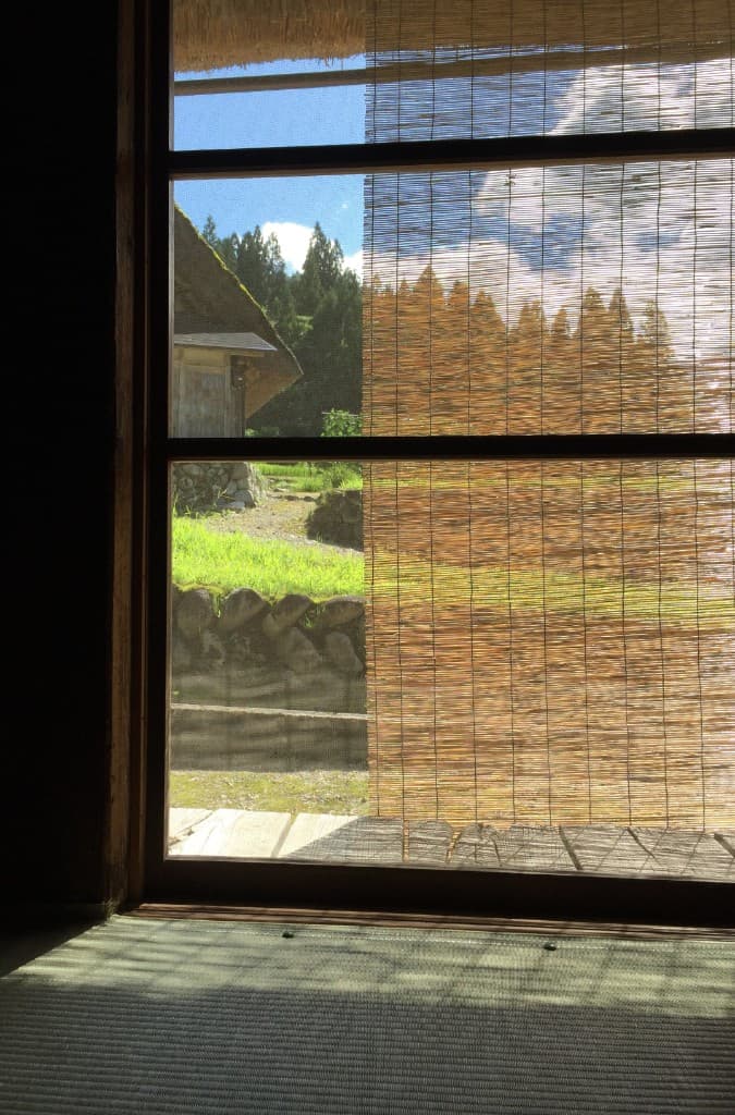 View of Shirakawa-go village through a sudare screen from inside Shimizu Inn