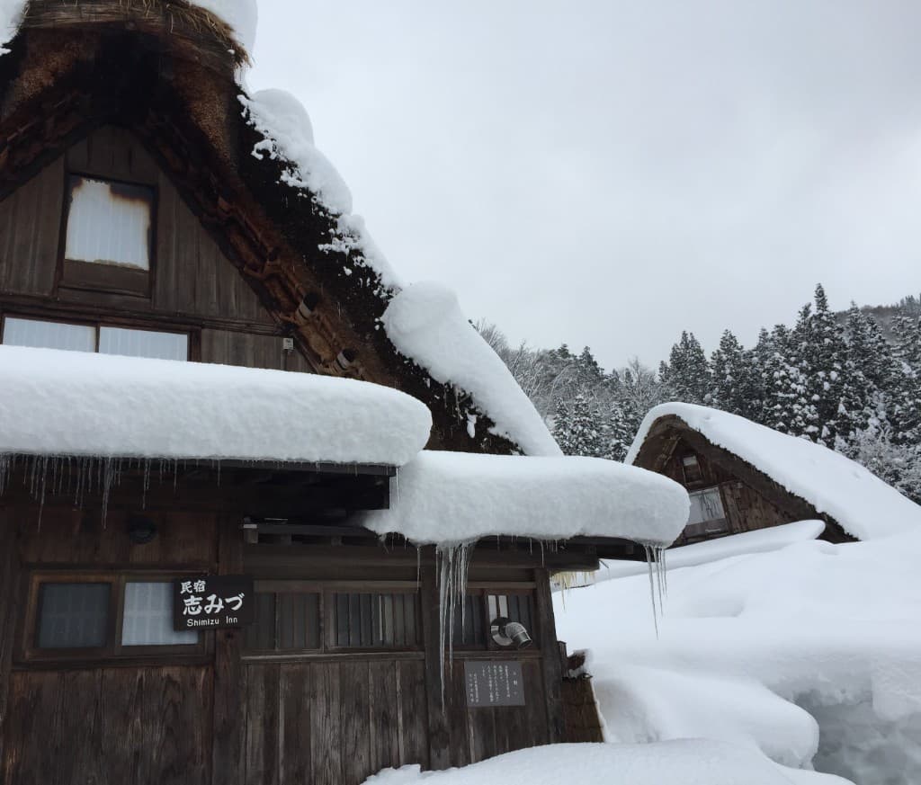 Shimizu Inn exterior covered in snow, Shirakawa-go winter